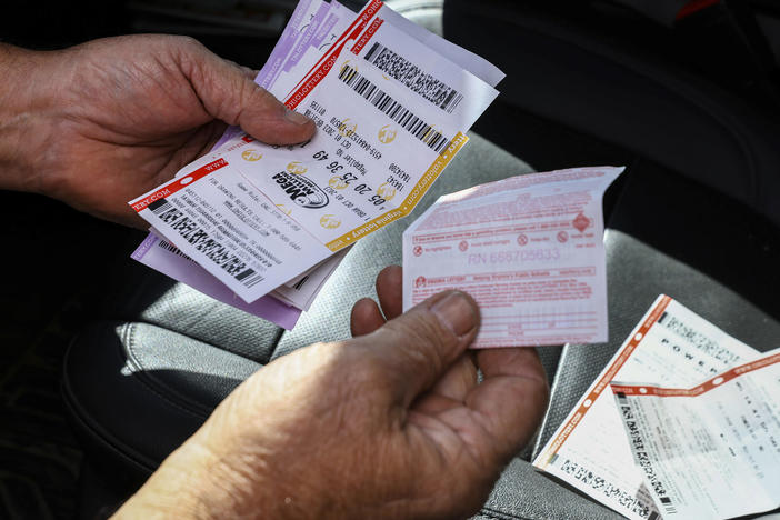 Bob Busson of Daytona Beach, Fla., bought Powerball tickets at the Curtice Carryout Monday, Oct. 9, 2023, in Curtice, Ohio.