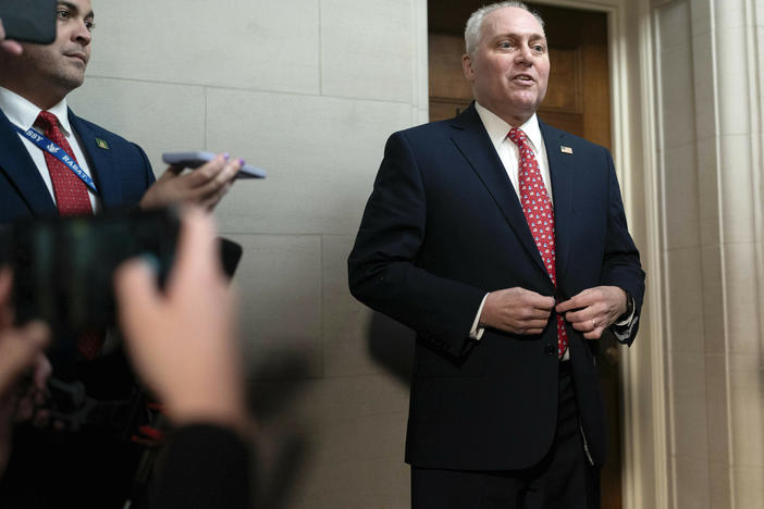House Majority Leader Steve Scalise, R-La., talks to reporters as he leaves Republicans' closed-door forum in which they heard from the candidates for House speaker on Tuesday.