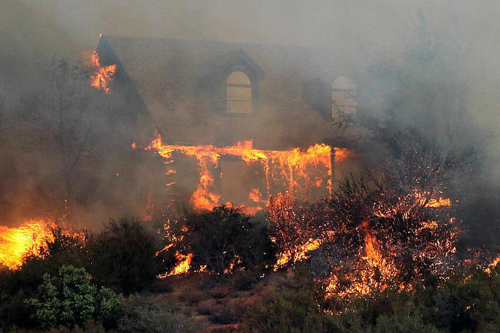 Many homes are destroyed in wildfires due to wind-driven embers that get caught in the landscaping. California is now drafting rules that would limit vegetation within five feet of a house.