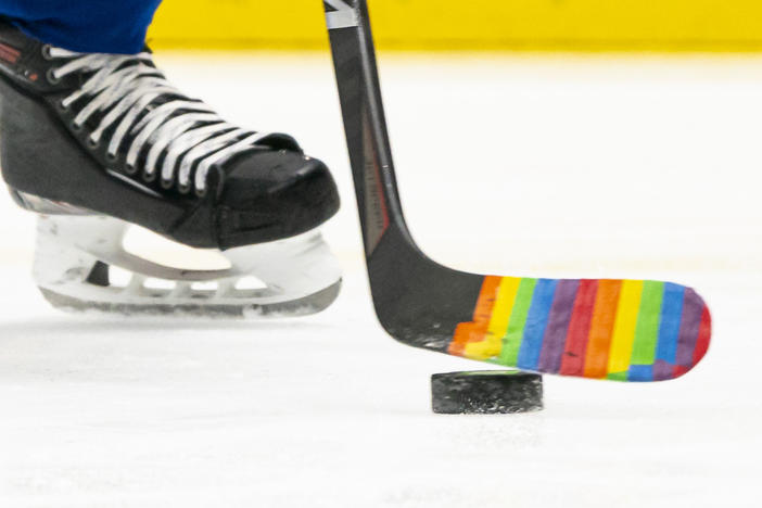 Pride Tape was quickly adopted by NHL teams as a way to support and celebrate LGBTQ+ fans and athletes. But the NHL has banned the tape. Here, a player used the tape on their stick for a pre-game warm up to celebrate a "Hockey is for Everyone" night in March 2021.