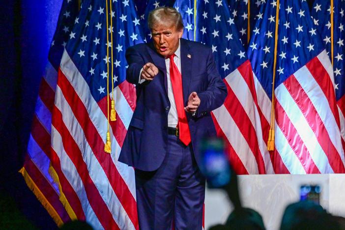Former president and 2024 Republican presidential hopeful Donald Trump gestures during a campaign event in West Palm Beach, Fla., on Oct. 11. He did not appear in nearby Fort Pierce for a court hearing the next day.