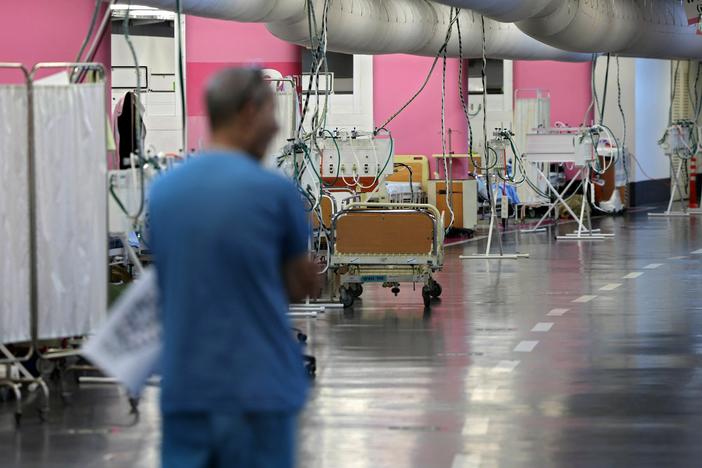 A man walks through a makeshift emergency underground hospital in the parking lot of the Rambam Health Care Campus (RHCC) in Haifa in northern Israel.