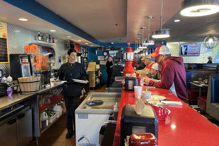 The walls of the Roundabout Diner illustrate the many candidates who have sat at the countertop to share a meal with potential voters over the years in Portsmouth, N.H. on Monday.