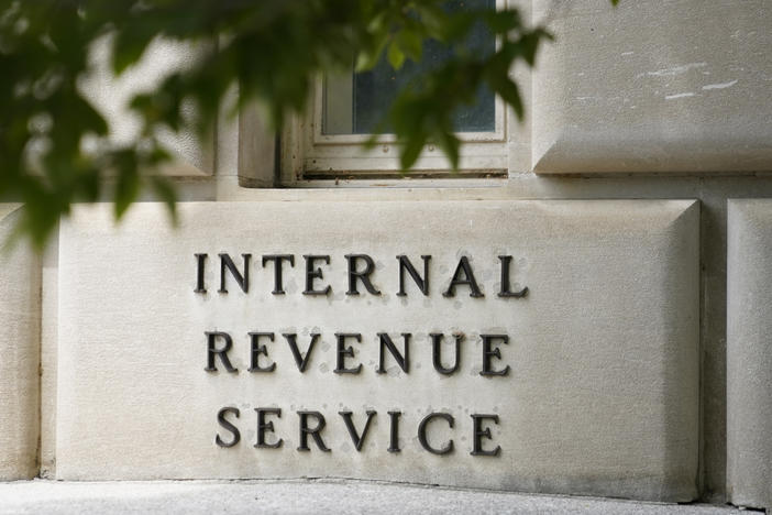 A sign outside the Internal Revenue Service building is seen, May 4, 2021, in Washington. The amount of tax money owed but not paid to the IRS is set to keep growing, according to projections published by the federal tax collection agency.