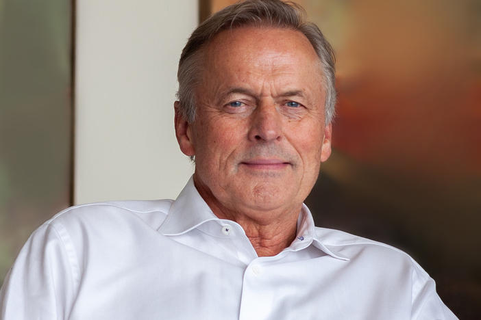 John Grisham at his office in Charlottesville, Va. His new book is a sequel to <em>The Firm</em>, the book that turned him into a star.