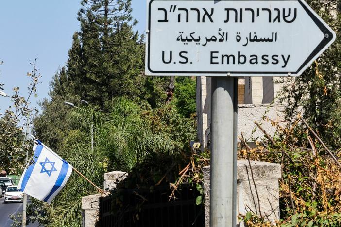 A road sign points the way to the U.S. Embassy in Jerusalem, which does not currently have an ambassador, hampering diplomatic efforts to calm violence between Israel and Hamas militants.
