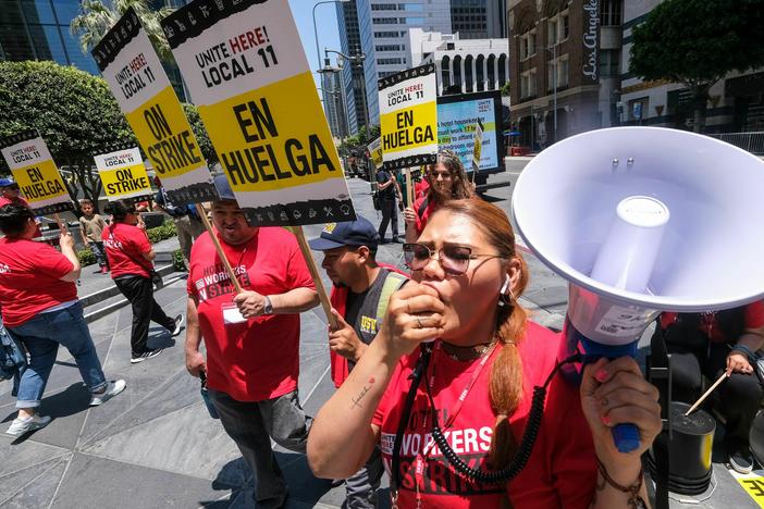 Striking hotel workers walk the picket line in Los Angeles, California, on July 2, 2023.