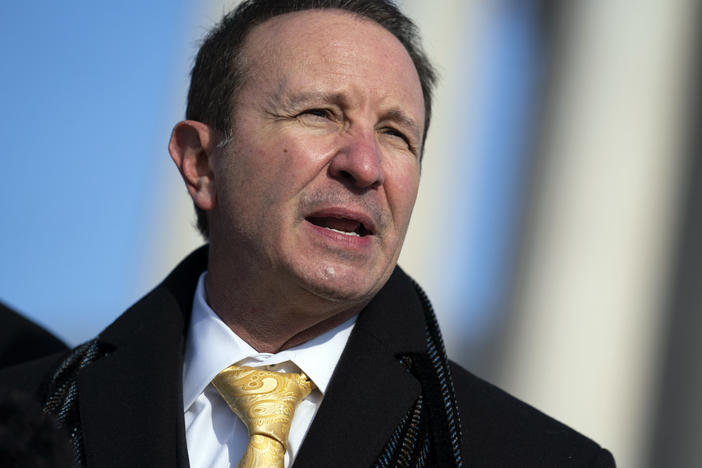 FILE - Louisiana Attorney General Jeff Landry talks to reporters outside the Supreme Court, Jan. 7, 2022, in Washington.