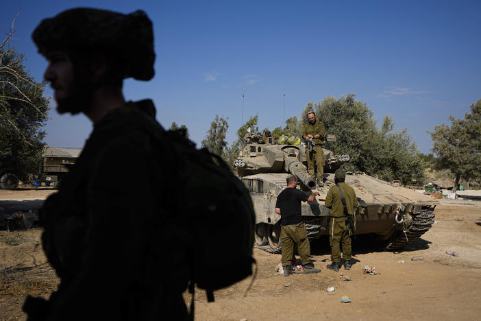 Israeli soldiers gather in a staging area near the border with Gaza Strip, in southern Israel Tuesday.
