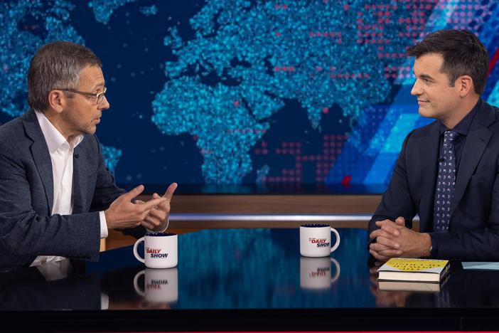 Author and political scientist Ian Bremmer, left, speaks with <em>The Daily Show</em> guest host Michael Kosta.