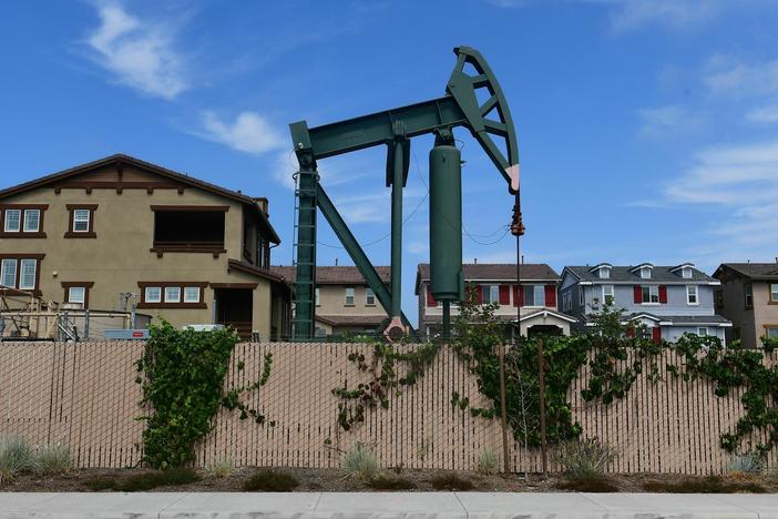 Hundreds of active oil wells sit in densely populated and mostly low-income neighborhoods in Los Angeles. A new report details why equity should be central to climate and energy policy in the U.S. to address historical practices.