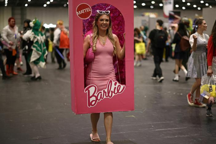 A cosplayer dressed as a boxed Barbie doll attends the MCM Comic Con at ExCeL exhibition centre in London on May 26, 2023.