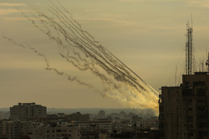 Palestinian militants fire rockets into Israel from Gaza Strip, Oct. 7.