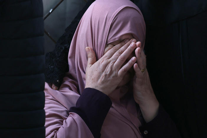 A Palestinian woman mourns after an Israeli airstrike at the Rafah refugee camp, in the southern Gaza Strip on Tuesday.