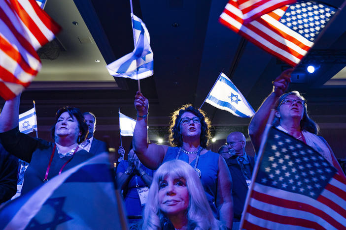 A crowd of mostly Evangelical Christians waves U.S. and Israeli flags during the Christians United For Israel (CUFI) "Night to Honor Israel" event during the CUFI Summit 2023 on July 17, 2023, in Arlington, Va.