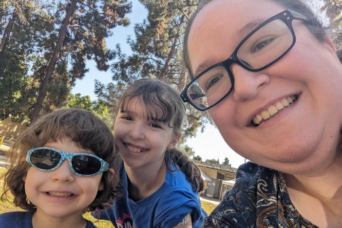 Anne Hamilton with two of her children, 11-year-old Katie and 4-year-old Jimmy. Hamilton spent XX days/weeks searching for a vaccine for Jimmy, who needed the formulation for children under 5. She was finally able to get him vaccinated here at this pop-up vaccine clinic in Obregon Park, run by the L.A. County Dept. of Public Health.