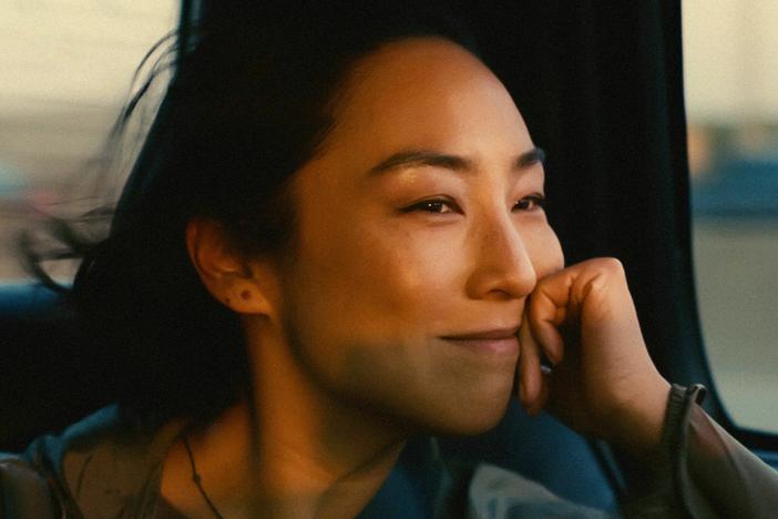 Greta Lee stars as a playwright caught between her American husband and her Korean childhood sweetheart in <em>Past Lives.</em>