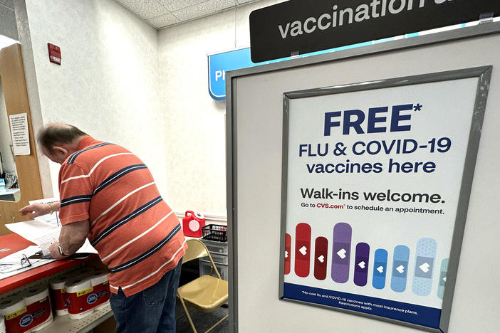 Flu and COVID-19 vaccinations are now available across the U.S., including at this CVS pharmacy in Palatine, Illinois.