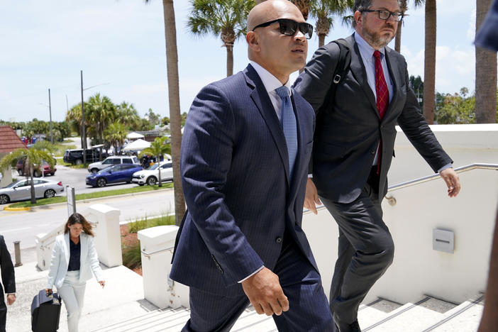 Walt Nauta (left), an aide to former President Donald Trump, arrives with defense attorney Stanley Woodward for a July hearing in federal court in Fort Pierce, Fla.