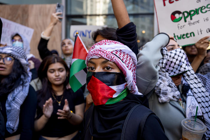 Students from Hunter College chant and hold up signs during a pro-Palestinian demonstration at the entrance of their campus in New York earlier this month.