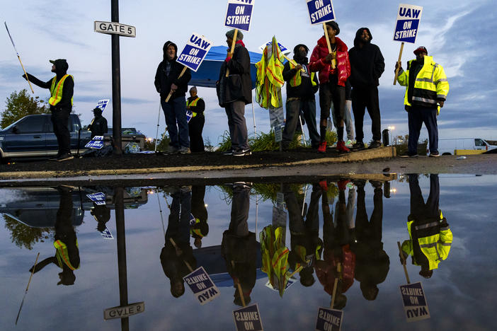 Factory workers and UAW union members form a picket line outside the Ford Motor Co. Kentucky Truck Plant in the early morning hours on October 14, 2023 in Louisville, Kentucky.