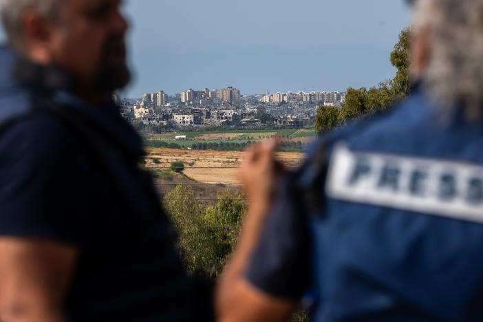 Members of the press wait on an overlook in Sderot, Israel, to report on the fighting in Gaza on Oct. 21.