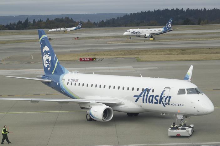 An Alaska Airlines plane, like this one operated by Horizon Air, had to divert to Portland, Ore. on Sunday after an off-duty pilot tried to turn off the engines in flight.