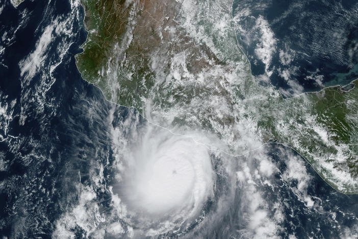 This satellite image provided by NOAA on Tuesday shows Hurricane Otis approaching Mexico's Pacific coast near Acapulco.