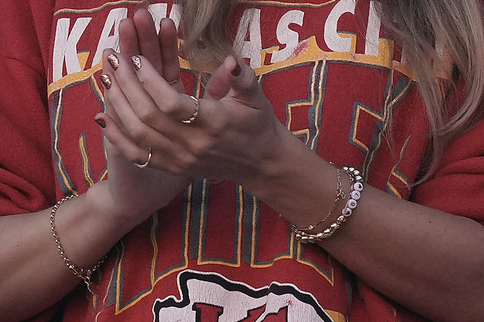 Taylor Swift wears a friendship bracelet with Kansas City Chiefs tight end Travis Kelce's number 87 while watching a game between the Kansas City Chiefs and the Los Angeles Chargers on Oct. 22, 2023, in Kansas City, Mo.