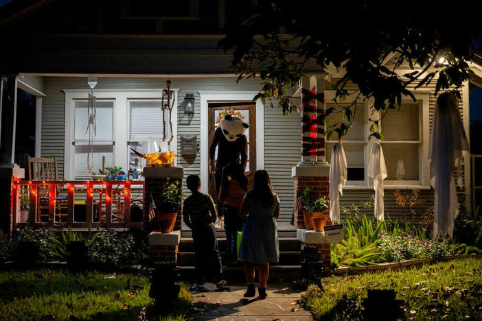 Children go trick-or-treating on Oct. 31, 2022, in Houston.
