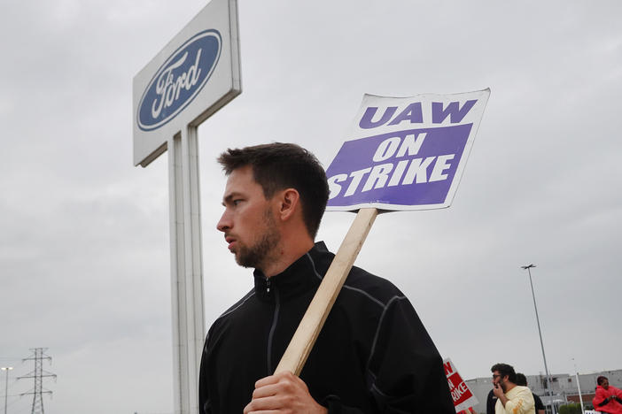 UAW workers picket outside of Ford's Wayne Assembly Plant in Wayne, Mich., on Sept. 26, 2023. The union and Ford reached a tentative agreement on Wednesday, in a major potential development in the ongoing strike against the Big Three automakers.
