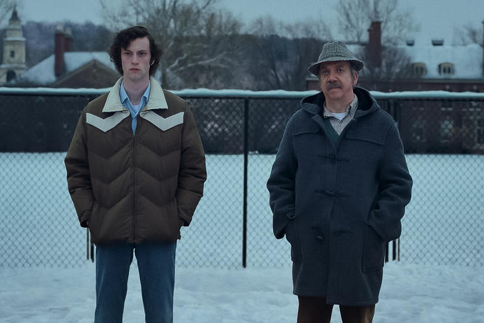 Dominic Sessa stars as Angus Tully and Paul Giamatti is Paul Hunham in Alexander Payne's <em>The Holdovers.</em>