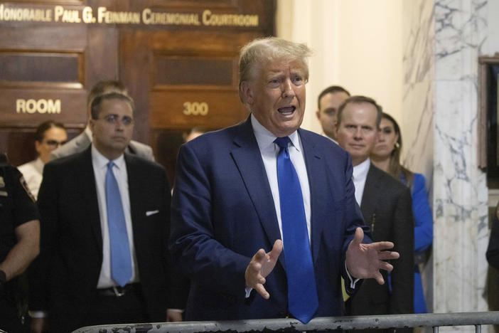 Former President Donald Trump speaks to the media as he exits the courtroom of his civil business fraud trial at New York Supreme Court on Wednesday.