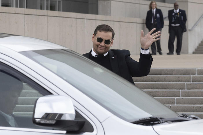 U.S. Rep. George Santos leaves the federal courthouse in Central Islip, N.Y., on Friday after pleading not guilty to charges in a revised indictment.