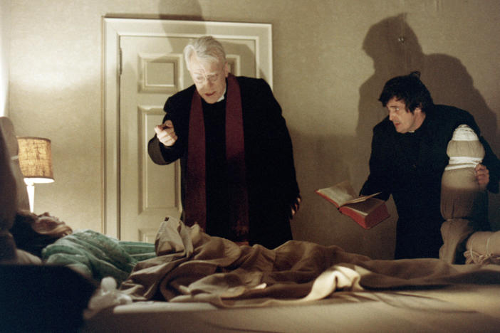 Priests, played by Max von Sydow and Jason Miller, try to help a possessed child in <em>The Exorcist,</em> from 1973.