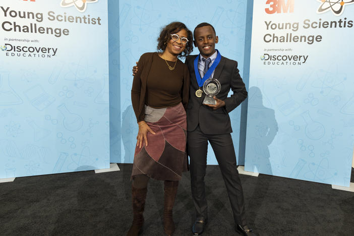 Heman Bekele with the help of his 3M mentor, Deborah Isabelle (left), created a prototype soap to treat melanoma. Isabelle said of Bekele, "he's going to continue to inspire other young people to realize that science can make a positive difference."