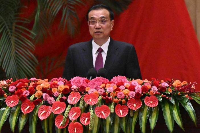 Chinese Premier Li Keqiang is shown speaking during a reception at the Great Hall of the People on the eve of China's National Day in Beijing on September 30, 2022.