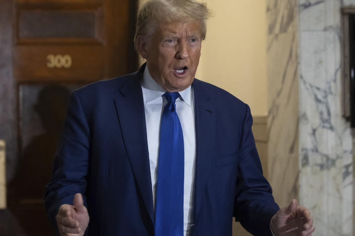Former President Donald Trump arrives at the courtroom for his civil business fraud trial at New York Supreme Court on Oct. 25, 2023.