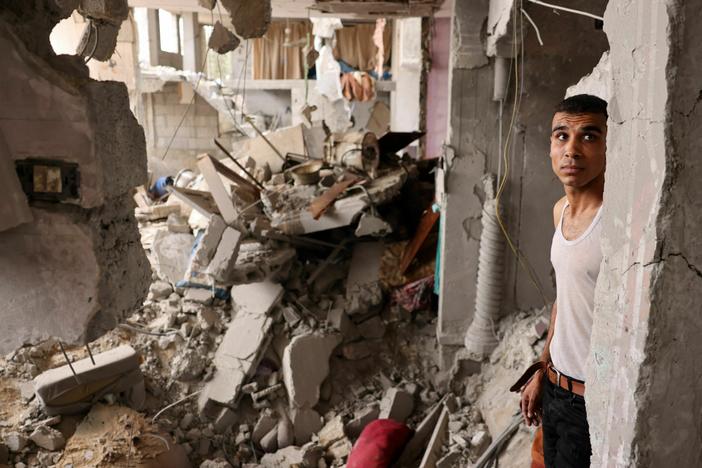 A man stands amid the rubble of a building in the aftermath of Israeli bombing in Rafah in the southern Gaza Strip on Sunday.