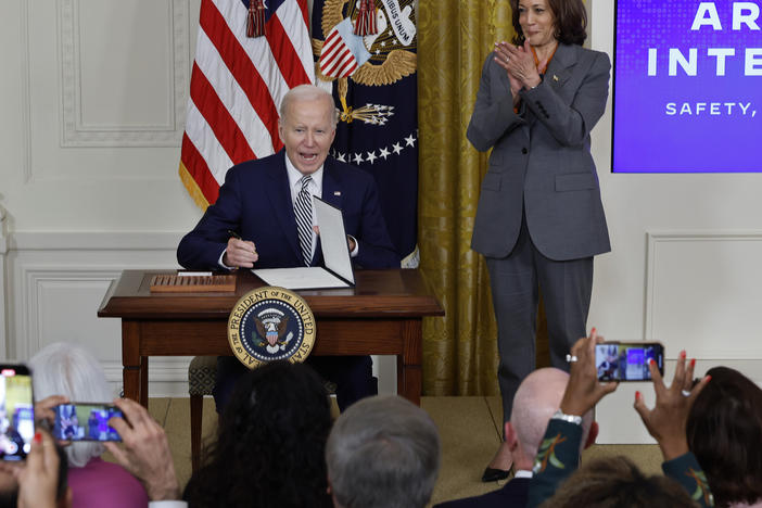 President Biden signs a new executive order on artificial intelligence on Oct. 30. Vice President Harris will talk about the order in London with world leaders this week.