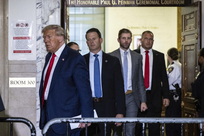 Former President Donald Trump leaves the courtroom during a break in his civil fraud trial on Oct. 17 in New York.