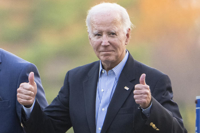 President Biden gestures with two thumbs up responding to a question from the media about UAW deal as he leaves St. Joseph on the Brandywine Catholic Church in Wilmington, Del., on Oct. 28.