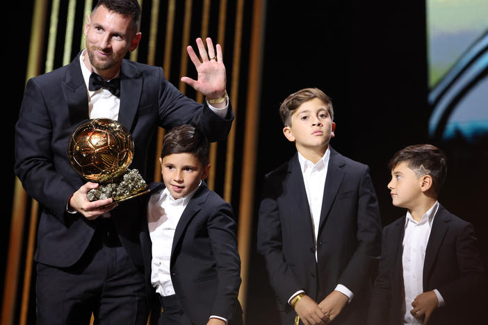 Lionel Messi accepted his eighth Ballon d'Or trophy, and was joined by his sons at the awards ceremony in Paris.