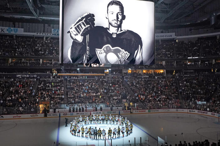 Players from the Pittsburgh Penguins and Anaheim Ducks on Monday honored former Penguin player Adam Johnson, who died during a game in England. The Penguins are making neck guards mandatory for players at the minor-league level, and will also urge NHL players to wear them.