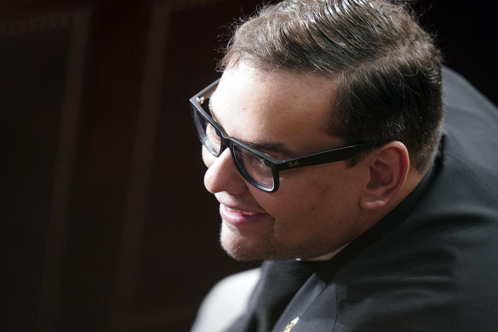 Rep. George Santos, R-N.Y., is shown listening as Republicans try to elect Rep. Mike Johnson, R-La., to be the new House speaker, at the Capitol in Washington, Wednesday, Oct. 25, 2023.