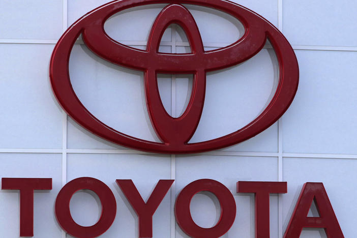 The Toyota logo is seen on a dealership, Aug. 15, 2019, in Manchester, N.H. Toyota said Wednesday, Nov. 1, 2023, that it is recalling nearly 1.9 million RAV4 small SUVs in the U.S. to fix a problem with batteries that can move during forceful turns and potentially cause a fire.