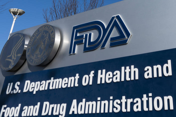 A sign for the U.S. Food and Drug Administration is displayed outside its offices in Silver Spring, Md., on Dec. 10, 2020. The FDA says it's considering banning brominated vegetable oil, a food additive.