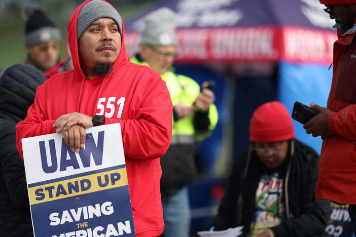Workers picket outside a Ford plant in Chicago on Oct. 10, 2023. The U.S. created 150,000 jobs in October, marking a slowdown from the previous month, partly as a result of the UAW strikes.