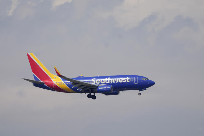 A Southwest Airlines jetliner approaches Denver International Airport on May 26. The airline has spent months preparing for the holiday travel season after a meltdown last December that left thousands stranded.