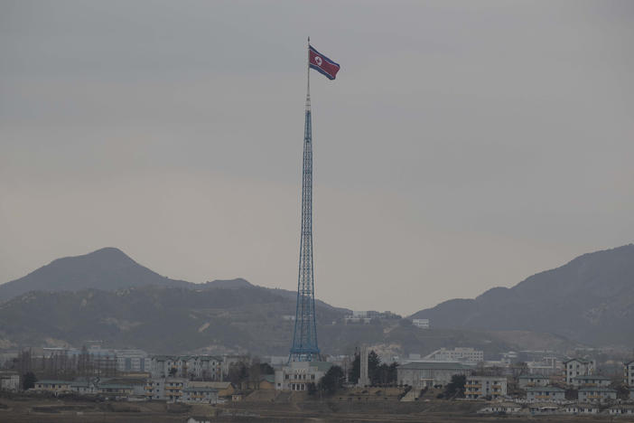 A North Korean flag flutters in North Korea's village Gijungdong as seen from a South Korean observation post inside the demilitarized zone in Paju, South Korea on March 3, 2023. North Korea confirmed that it's closing some of its diplomatic missions abroad.